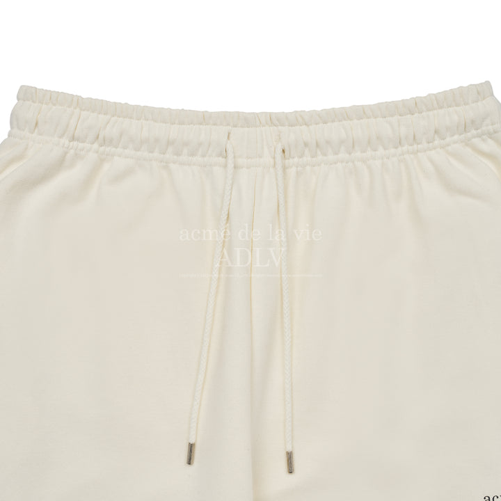 ADLV CIRCLE SYMBOL RIVET PANTS CREAM